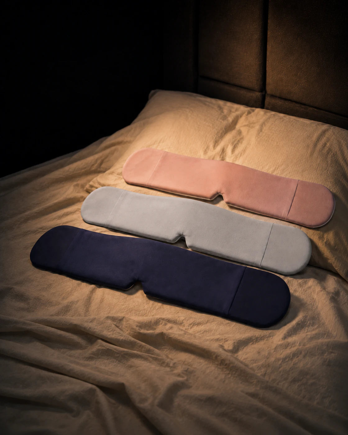 Blue, grey, and pink weighted sleep mask color options